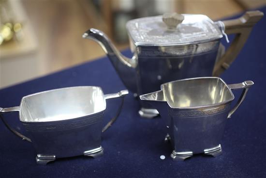 A 1930s silver three piece tea set by Stower & Wragg, gross 42.4oz.